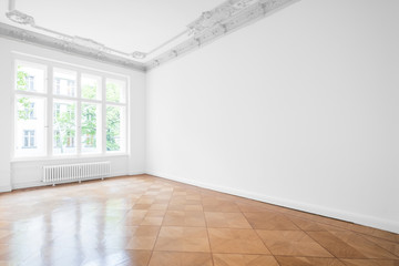 Empty room with parquet floor , white walls