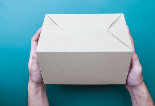 Hand holding a box