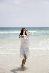 Fototapeta na wymiar Young Vietnamese woman on the beach