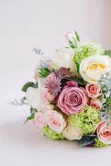 Bride's Wedding flowers on cream colour background, Rose bouquet