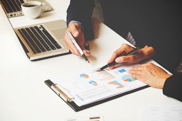 Business team meeting present. Professional investor working with new startup project. Digital tablet laptop computer design smart phone in office.