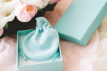 Wedding prop on pink rose background, Pale blue jewellery box and bag