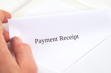 Payment Receipt printed on white paper and envelope, hand holding it, white background