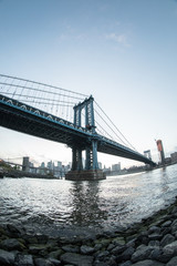 An iconic shot of New York City's Manhattan Bridge - DUMBO, Brooklyn. Shot from the Cobblestone of Washington Street during the Spring of 2017 with a Fisheye Lens.