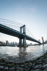 New York City's Manhattan Bridge at suset - DUMBO, Brooklyn. Shot with a fisheye lens during the spring of 2017.