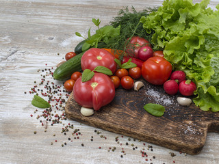 Fresh vegetables on a wooden background. 
