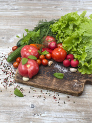 Fresh vegetables on a wooden background. 