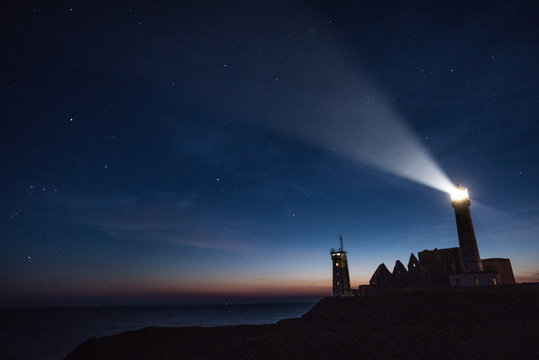 Abbey ruin and lighthouse by night, Pointe de Saint-Mathieu, Brittany, France