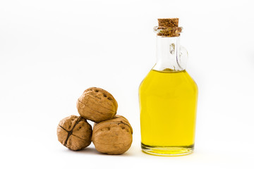 Walnuts oil isolated on white background
