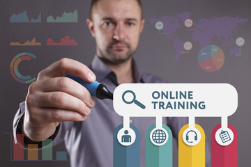 Business, Technology, Internet and network concept. Young businessman working on a virtual screen of the future and sees the inscription: Online training