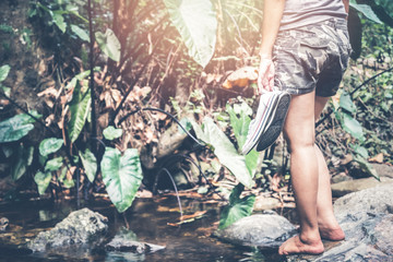 Obraz premium woman travelers travel nature Forests, relax play waterfall