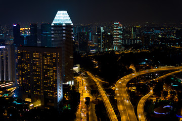 High Angle View Of Illuminated Multiple Lane Against City by Night