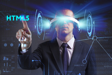 Business, Technology, Internet and network concept. Young businessman working in virtual reality glasses sees the inscription: HTML5