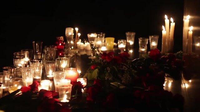 Candles and flowers at the memorial in memory of the victims of the victims of the terrorist attack. People mourn and look for relatives and friends. Sorrow and despair. Politics, military actions