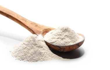 Pile of wheat flour in wooden spoon isolated on white background, 