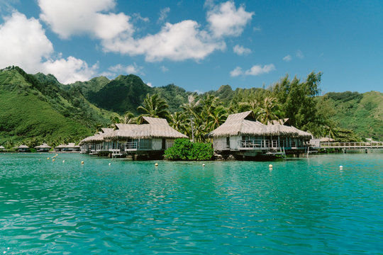 Bungalows over sea by mountains, Tahiti, South Pacific