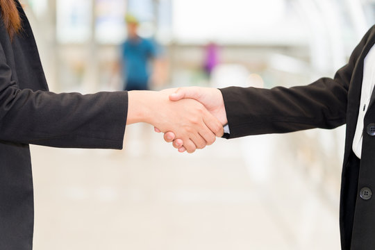 Close up of businesswoman shaking hands while standing