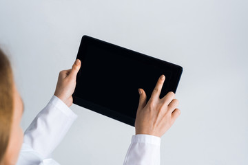 Close of female doctor hands working with tablet pc computer