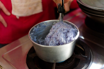 Preparing blue sticky rice