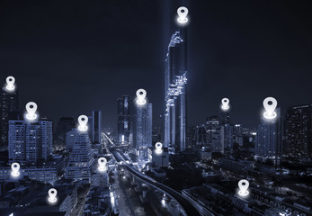 Map pin flat above blue tone city scape