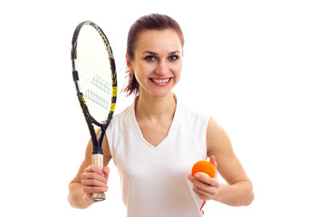 Woman with tennis racquet and ball