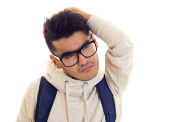 Young man with glasses and backpack