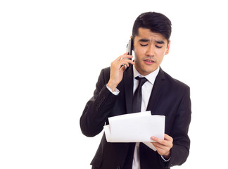 Young man in suit holding papers