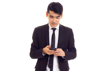 Young man in suit talking on the phone