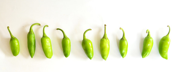 green peppers on white background 