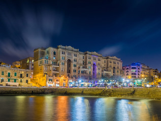 Fototapeta na wymiar Malta- Colorful lights of the beautiful Balluta Bay by night
