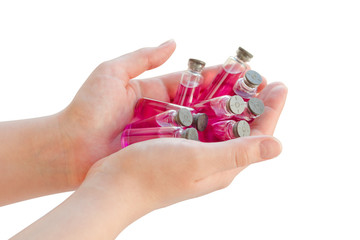 Ampoule in woman hand isolated on white background