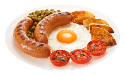 Grilled sausages with potatoes, peas, tomatoes and egg on the plate. Isolated on white background.