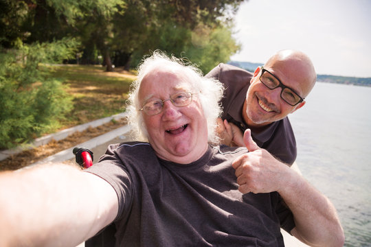Old Man In Wheelchair Taking A Selfie