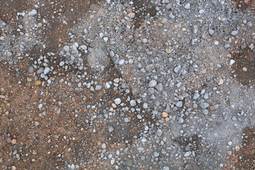 Mixed sand and cement. Mixed sand and cement is prepared for work on the construction site for repairing the road surface.