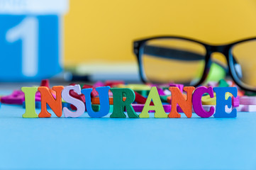 Insurance - word composed of small colored letters on business workplace of broker. Illustration of...