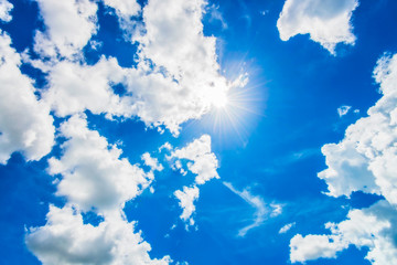 Bright sun in blue sky.