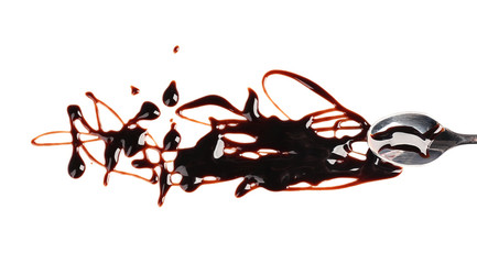 Delicious chocolate sauce on white background with spoon