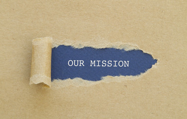 Our Mission message written under torn paper