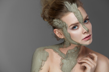 Spa Procedure. Female With Cosmetic Facial And Body Mask