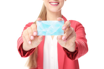 Beautiful young woman with business card on white background, closeup