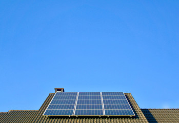 Photovoltaic panel on the roof of a residential building for environmental friendly energy production