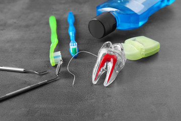 Dental instruments and set for teeth cleaning on grey background