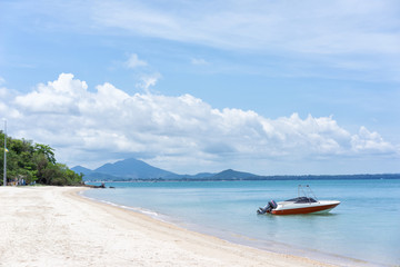 Fototapeta na wymiar Paradise Beach at the Tropical Island, Boat and blue sky