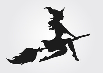 Silhouette of a witch flying on a broomstick - obrazy, fototapety, plakaty