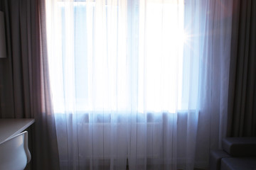 Window and beautiful curtains in flat