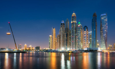 Fototapeta premium Dubai Marina waterfront from offshore at blue hour. May 2017