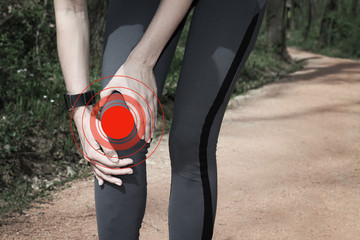 Knee injury, Woman runner with knee pain outdoors