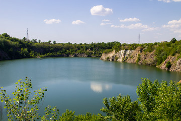 Fototapeta na wymiar Lake at abandoned quarry