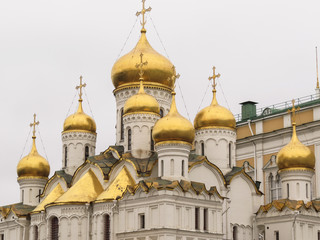Fototapeta na wymiar Annunciation Cathedral, one of the churches in Cathedral Square at the Kremlin in Moscow. Curved corbel arches known as kokoshniki support its multiple onion domes.