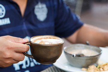 Man eating breakfast and drink coffee